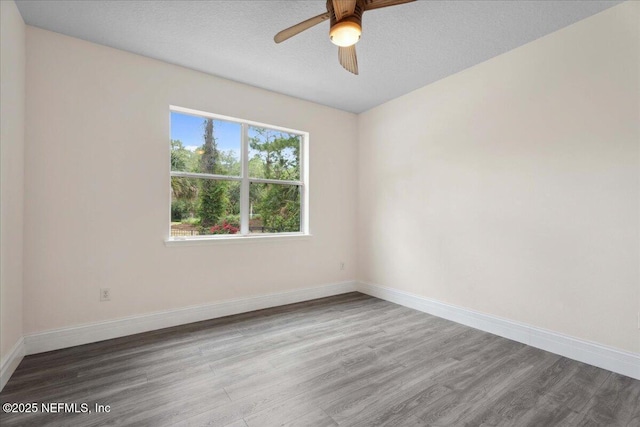 3357 Pegaso Ave, New Smyrna Beach, FL 32168 - empty room featuring wood finished floors, ceiling fan, and baseboards