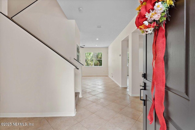 3357 Pegaso Ave, New Smyrna Beach, FL 32168 - entrance foyer with stairs, light tile patterned floors, baseboards, and recessed lighting