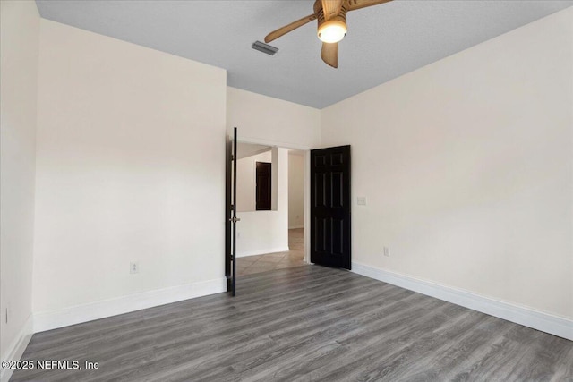 3357 Pegaso Ave, New Smyrna Beach, FL 32168 - unfurnished room featuring a ceiling fan, wood finished floors, and baseboards