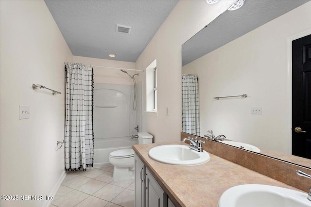 3357 Pegaso Ave, New Smyrna Beach, FL 32168 - full bathroom with toilet, tile patterned flooring, double vanity, shower / bath combo, and baseboards
