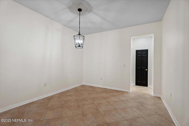 3357 Pegaso Ave, New Smyrna Beach, FL 32168 - unfurnished room featuring a chandelier and baseboards