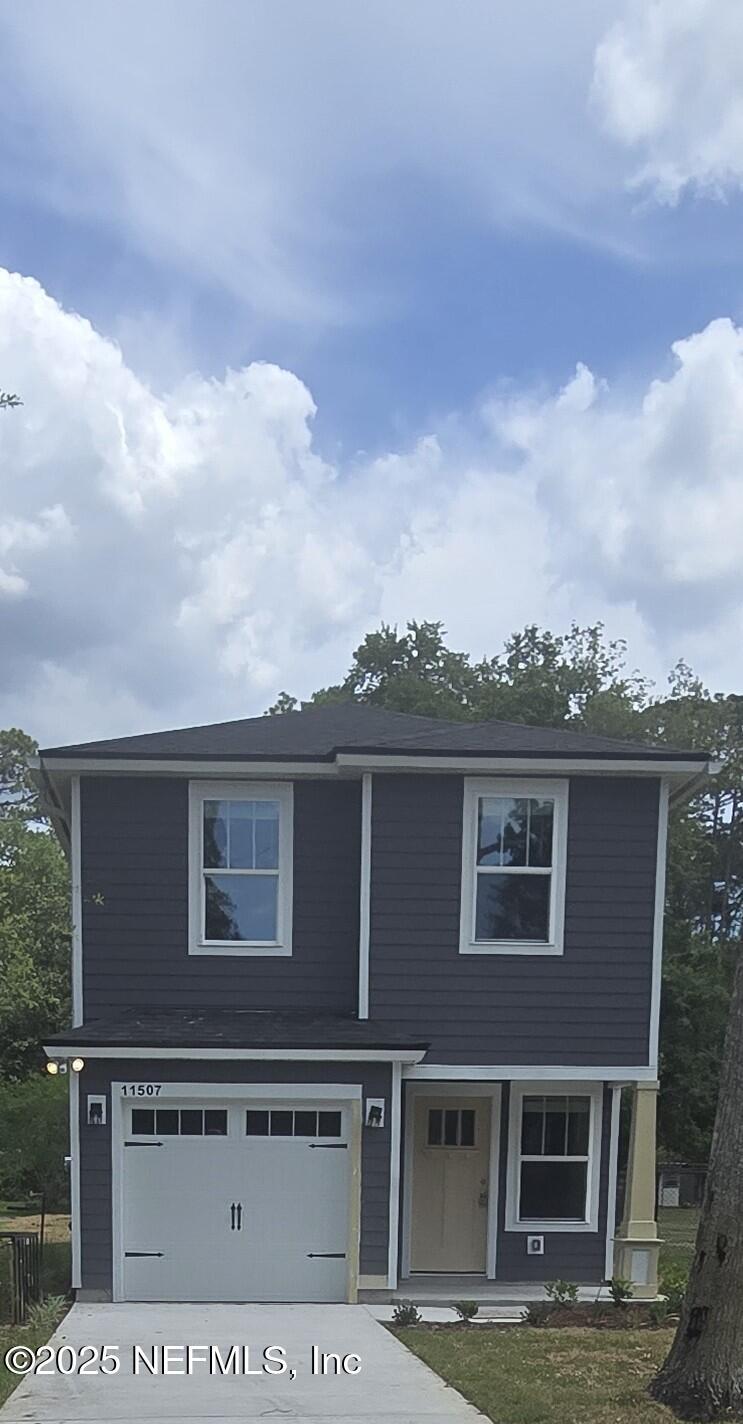 11503 Hobart Blvd, Jacksonville, FL 32218 - view of front of home featuring concrete driveway and a garage