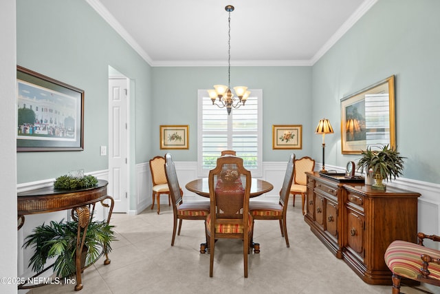 90 Canopy Glades Cir, Ponte Vedra, FL 32081 - dining space with a chandelier, ornamental molding, a wainscoted wall, light tile patterned floors, and a decorative wall