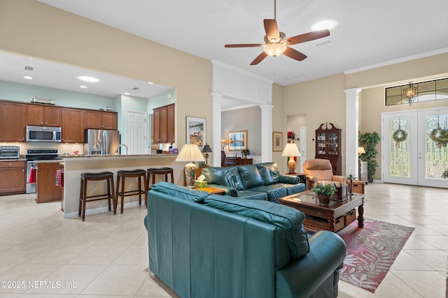 90 Canopy Glades Cir, Ponte Vedra, FL 32081 - living room with decorative columns, light tile patterned floors, and a ceiling fan