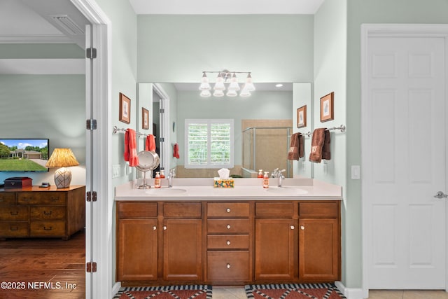 90 Canopy Glades Cir, Ponte Vedra, FL 32081 - ensuite bathroom featuring a shower stall, a chandelier, and double vanity