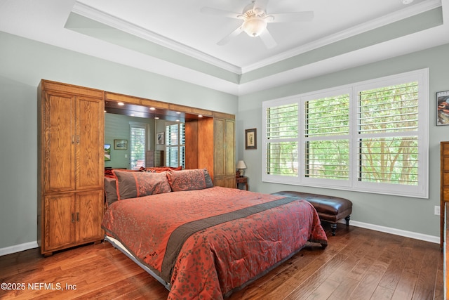 90 Canopy Glades Cir, Ponte Vedra, FL 32081 - bedroom featuring hardwood / wood-style flooring, ornamental molding, baseboards, a tray ceiling, and a ceiling fan