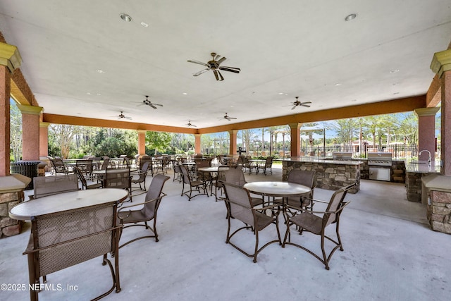90 Canopy Glades Cir, Ponte Vedra, FL 32081 - view of patio / terrace featuring exterior kitchen, outdoor dining space, fence, and ceiling fan