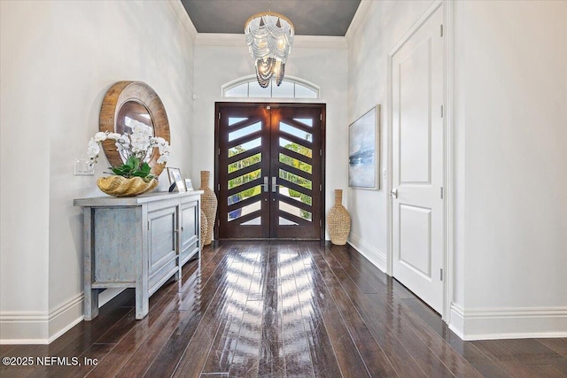 231 N Roscoe Blvd, Ponte Vedra Beach, FL 32082 - entrance foyer featuring a chandelier, wood-type flooring, baseboards, and crown molding