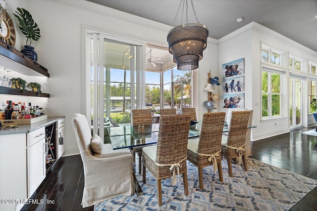 231 N Roscoe Blvd, Ponte Vedra Beach, FL 32082 - dining room with healthy amount of natural light, dark wood finished floors, baseboards, ornamental molding, and a dry bar