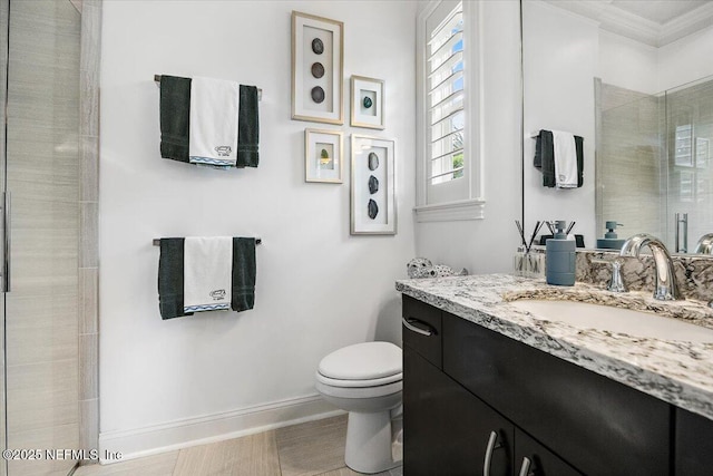 231 N Roscoe Blvd, Ponte Vedra Beach, FL 32082 - bathroom featuring a stall shower, baseboards, toilet, crown molding, and vanity