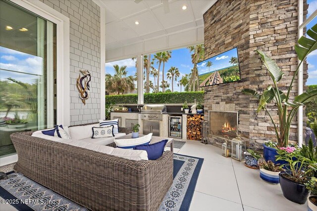 231 N Roscoe Blvd, Ponte Vedra Beach, FL 32082 - view of patio with an outdoor stone fireplace, an outdoor kitchen, a grill, and beverage cooler