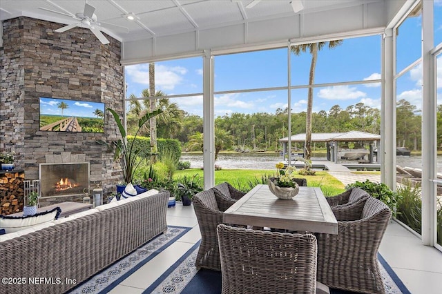 231 N Roscoe Blvd, Ponte Vedra Beach, FL 32082 - sunroom featuring ceiling fan, an outdoor living space with a fireplace, and view of wooded area
