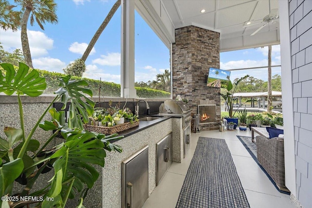 231 N Roscoe Blvd, Ponte Vedra Beach, FL 32082 - view of patio with an outdoor kitchen, an outdoor stone fireplace, area for grilling, and a sink