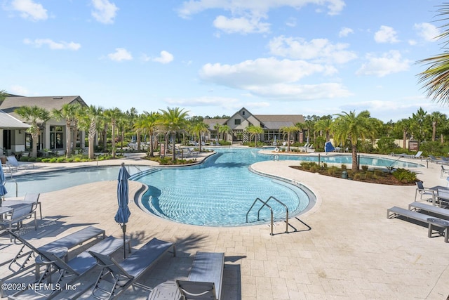 75556 Canterwood Dr, Yulee, FL 32097 - community pool featuring a patio area