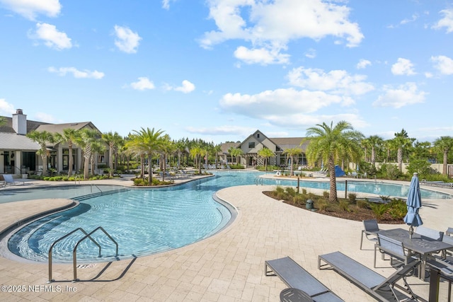 75556 Canterwood Dr, Yulee, FL 32097 - community pool featuring a patio area