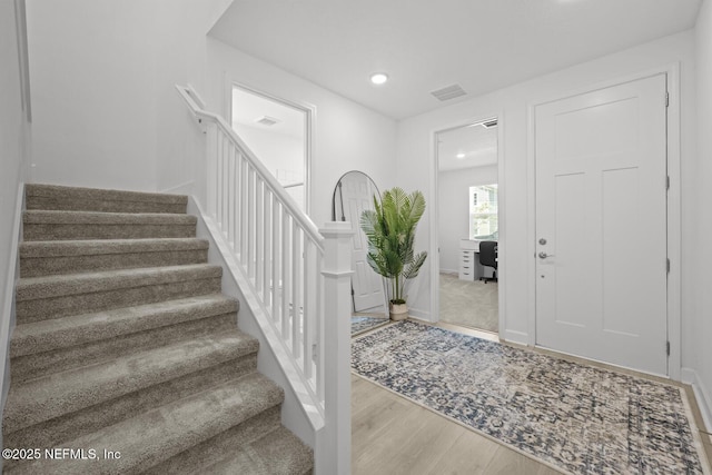 75556 Canterwood Dr, Yulee, FL 32097 - entrance foyer with wood finished floors, stairs, recessed lighting, and baseboards