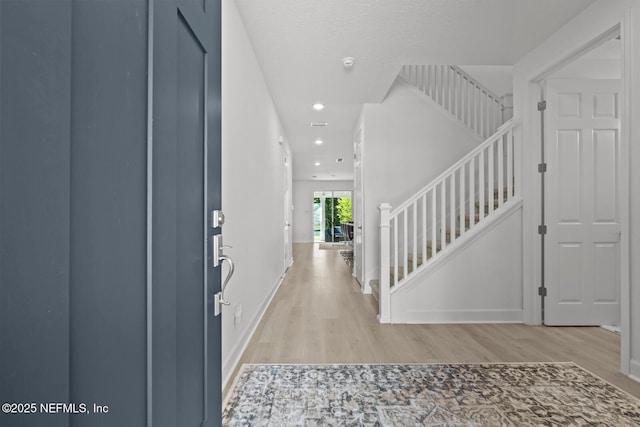 75556 Canterwood Dr, Yulee, FL 32097 - entryway with light wood-style floors, stairway, recessed lighting, and baseboards