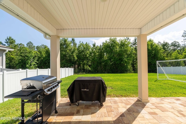 2565 Cold Stream Ln, Green Cove Springs, FL 32043 - view of patio with grilling area, fence, view of wooded area, and a sport area
