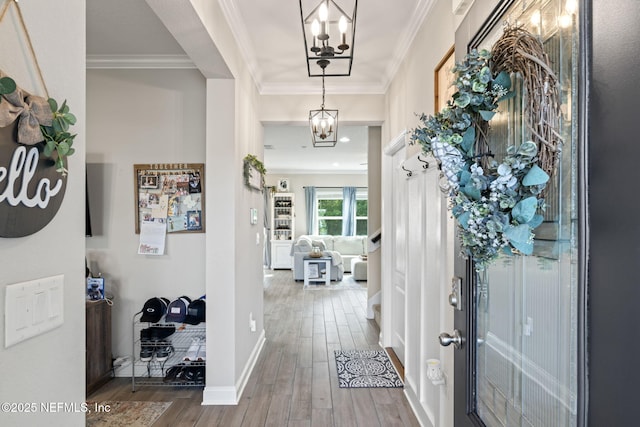 2565 Cold Stream Ln, Green Cove Springs, FL 32043 - entrance foyer with wood finished floors, a chandelier, ornamental molding, and baseboards