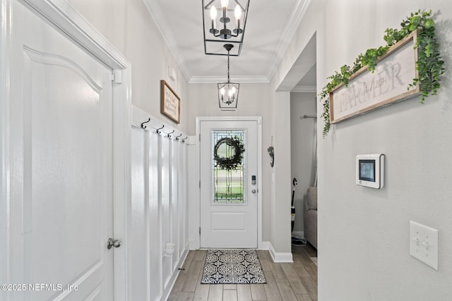 2565 Cold Stream Ln, Green Cove Springs, FL 32043 - foyer with a chandelier, light wood-style floors, crown molding, and baseboards