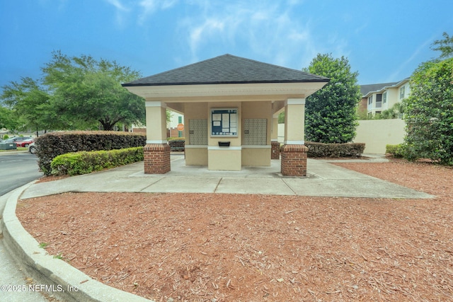 view of home's community featuring mail area