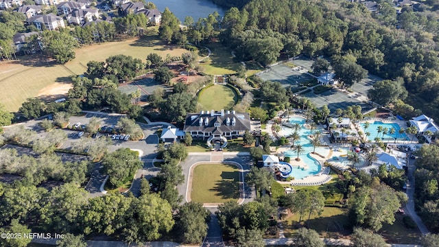aerial view of property and surrounding area with a pool area