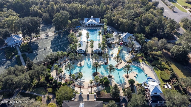 aerial view of property and surrounding area featuring a pool area