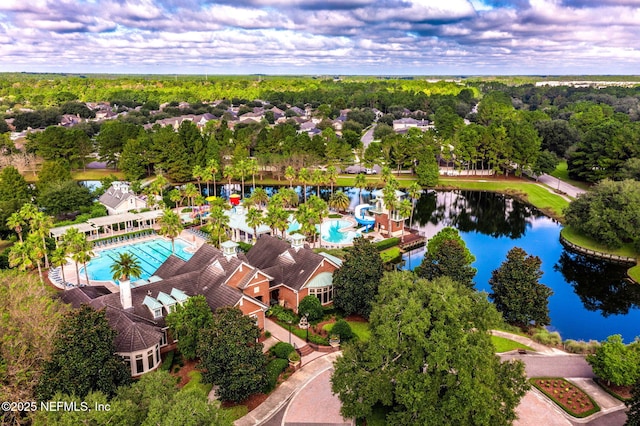 aerial view of a pool and a nearby body of water