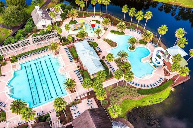aerial view of a pool and a large body of water