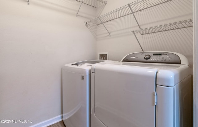 washroom with independent washer and dryer