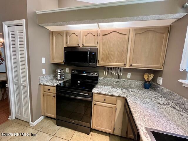 9536 Glenn Abbey Way, Jacksonville, FL 32256 - kitchen featuring black appliances, light brown cabinetry, light tile patterned floors, and light stone countertops