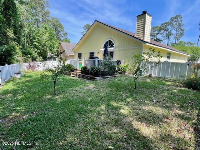 9536 Glenn Abbey Way, Jacksonville, FL 32256 - rear view of property with a chimney and a deck