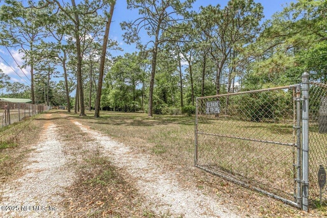 view of road featuring a gate