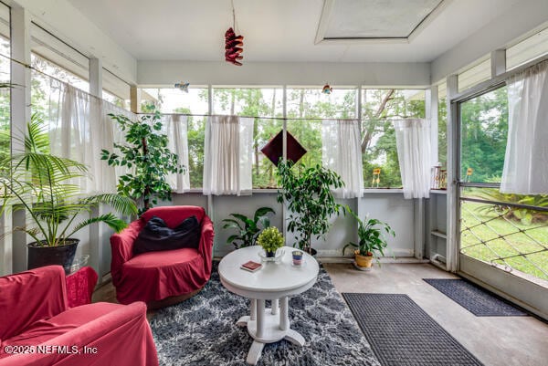 2760 Jerry Ln, Jacksonville, FL 32218 - sunroom / solarium featuring attic access and concrete floors