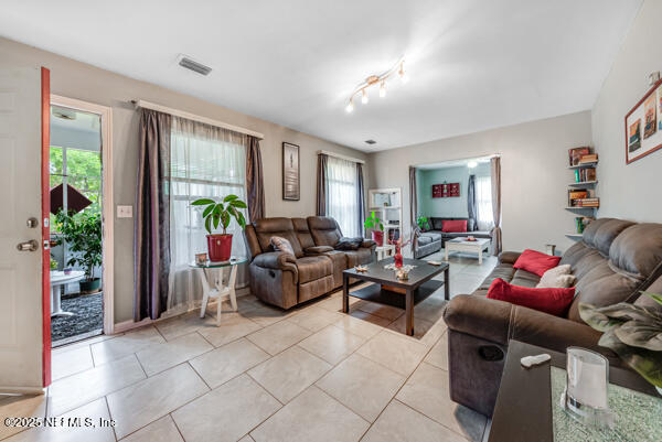 2760 Jerry Ln, Jacksonville, FL 32218 - living area with light tile patterned floors