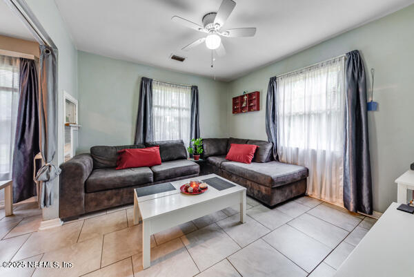 2760 Jerry Ln, Jacksonville, FL 32218 - living area with ceiling fan and light tile patterned flooring