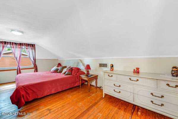 2760 Jerry Ln, Jacksonville, FL 32218 - bedroom featuring light wood-style flooring and vaulted ceiling