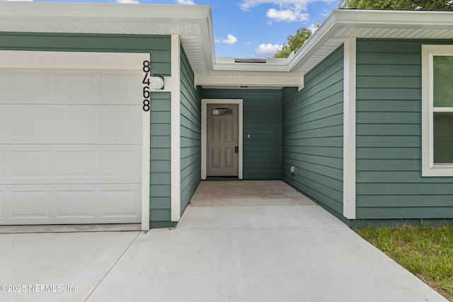 8468 Buttercup St, Jacksonville, FL 32210 - doorway to property featuring an attached garage
