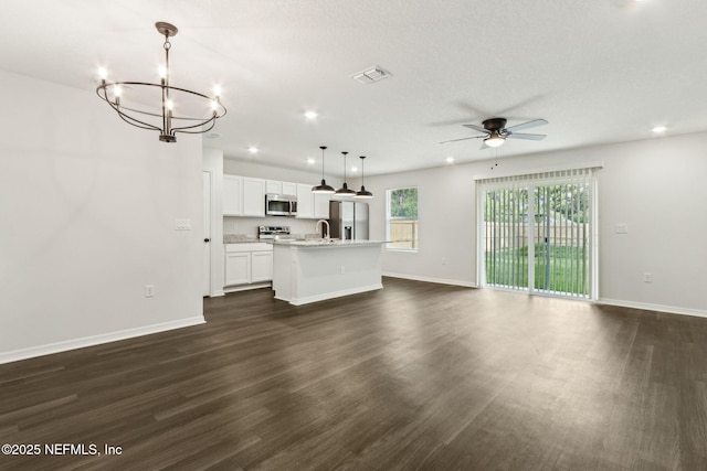 8468 Buttercup St, Jacksonville, FL 32210 - unfurnished living room featuring ceiling fan, dark wood-style flooring, a sink, baseboards, and recessed lighting