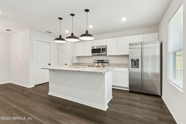 8468 Buttercup St, Jacksonville, FL 32210 - kitchen featuring stainless steel appliances, a sink, dark wood-type flooring, white cabinets, and baseboards