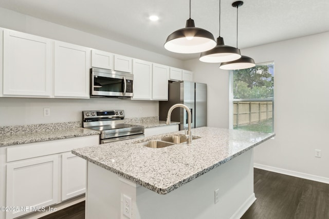 8468 Buttercup St, Jacksonville, FL 32210 - kitchen featuring stainless steel appliances, a sink, dark wood-style flooring, white cabinets, and recessed lighting