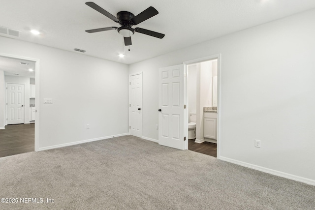 8468 Buttercup St, Jacksonville, FL 32210 - unfurnished bedroom featuring dark colored carpet, baseboards, recessed lighting, connected bathroom, and a ceiling fan