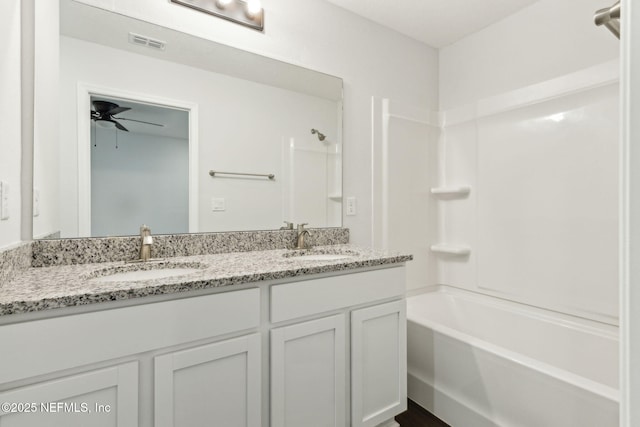 8468 Buttercup St, Jacksonville, FL 32210 - bathroom featuring double vanity, shower / tub combination, and ceiling fan