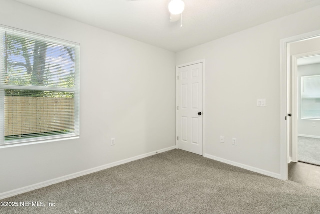 8468 Buttercup St, Jacksonville, FL 32210 - unfurnished bedroom with carpet, multiple windows, and baseboards
