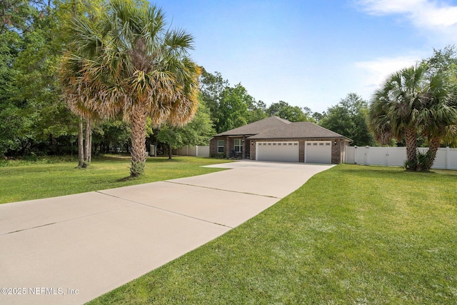1309 Foxmeadow Trl, Middleburg, FL 32068 - view of front of property with driveway, an attached garage, and brick siding