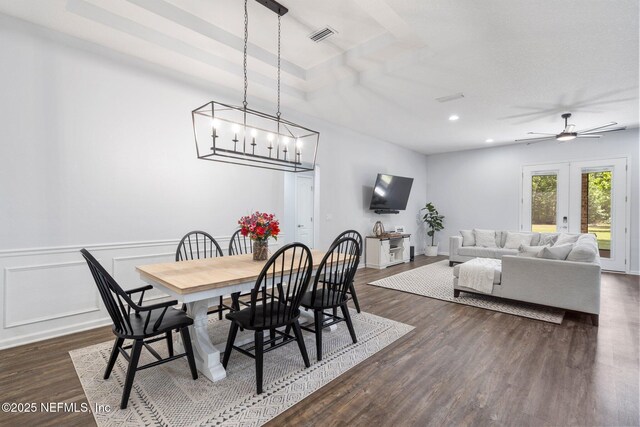 1309 Foxmeadow Trl, Middleburg, FL 32068 - dining area featuring dark wood-type flooring, recessed lighting, ceiling fan, a wainscoted wall, and a chandelier