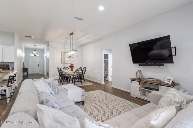 1309 Foxmeadow Trl, Middleburg, FL 32068 - living room with dark wood finished floors, a chandelier, recessed lighting, and baseboards
