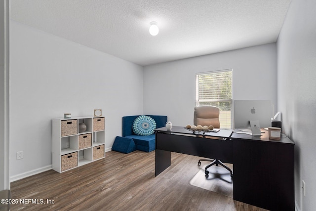 1309 Foxmeadow Trl, Middleburg, FL 32068 - home office featuring wood finished floors, a textured ceiling, and baseboards