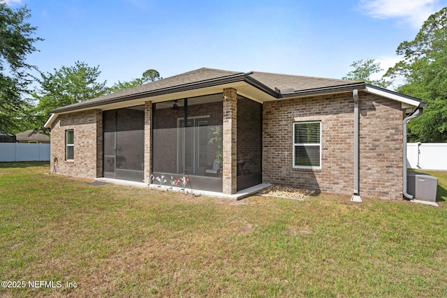 1309 Foxmeadow Trl, Middleburg, FL 32068 - rear view of property featuring a sunroom, brick siding, and a shingled roof