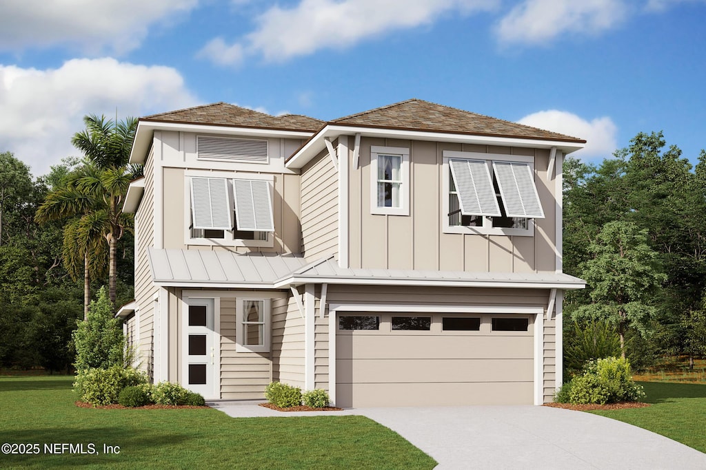view of front of house with a garage, a front yard, concrete driveway, and a standing seam roof